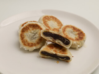 Bakpia is an Indonesia's traditional snack made from baked pastry and filled mung bean paste. Isolated on white 