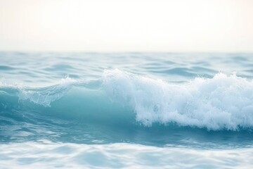 Obraz premium Gentle ocean waves rolling under soft light creating a calm and peaceful seascape