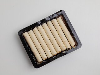 Rolled wafer or biscuits on white background