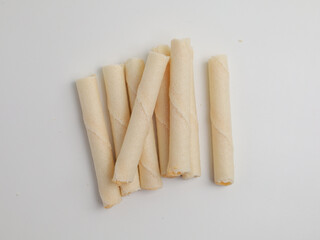 Rolled wafer or biscuits on white background