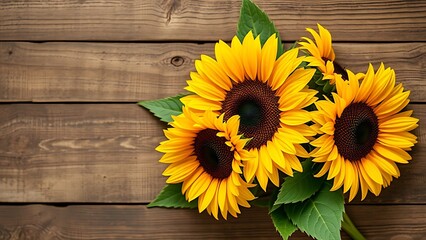 Fototapeta premium Sunflower bouquet on a rustic wooden surface with warm directional lighting.