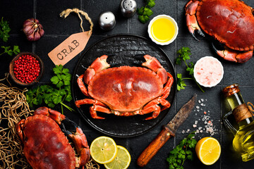 Seafood dish, Cooked crabs with butter, salt, garlic and parsley. Delicious crab claws. Sticker...