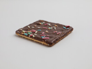 Crunchy crackers coated with chocolate and sprinkles