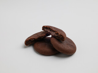 Chocolate cookies with chocolate filling on white background
