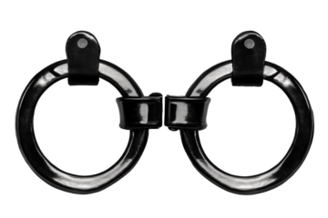 Handcuffs isolated on a transparent background showcasing a classic design with shiny black finish meant for law enforcement or security applications in various contexts