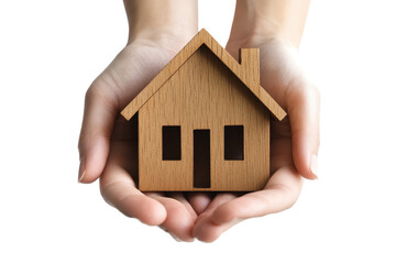 Hands holding a wooden house model showcasing craftsmanship and creativity with a focus on home and comfort in an isolated setting