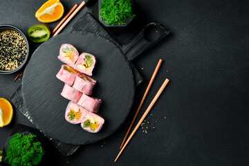 Japanese sushi rolls with fruit and yogurt. Sweet dessert.