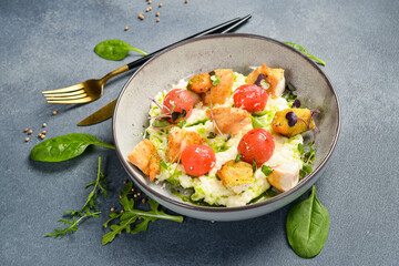 Risotto with chicken fillet and cherry tomatoes. In a plate. Restaurant dish. Close up.