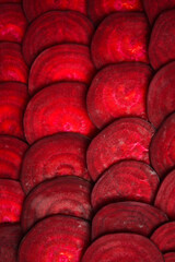 Fototapeta premium Red vegetable texture. Macro photo of beetroot. Top view.