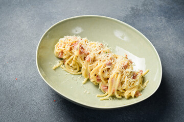 Carbonara pasta. Spaghetti pasta with bacon and Parmesan cheese. Italian dish. Close up.
