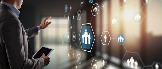 Diverse business team analyzing financial data and growth charts on digital tablet