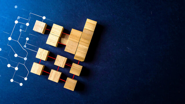 Organizational structure and business development concept with wooden blocks forming a growth chart linked to a digital data network