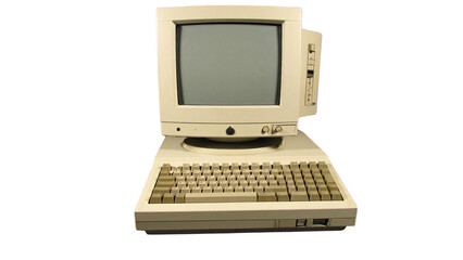 A classic beige all-in-one personal computer from the 1980s, showcasing vintage technology with a keyboard and monitor, isolated on a white background