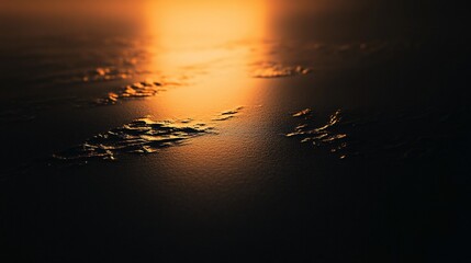 Sun reflects on water surface creating a bright light with dark surroundings.