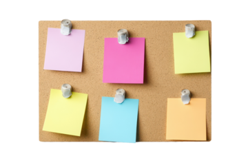 Colorful sticky notes arranged on a corkboard displaying various messages and reminders for organization and planning in a neat, creative way during daytime
