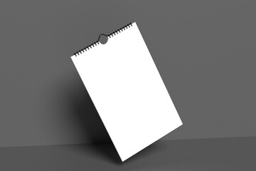 Mock up realistic wall calendar with spiral, gray background. White paper tear-off calendar. Empty template for spiral brochure, notepad and calendar.