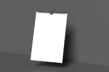Mock up realistic wall calendar with spiral, gray background. White paper tear-off calendar. Empty template for spiral brochure, notepad and calendar.