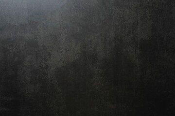 Dark grey textured concrete wall background
