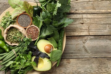 Superfood. Healthy food products on wooden table, top view. Space for text