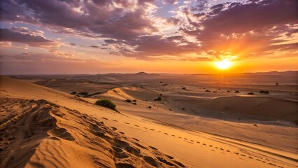 Golden desert dunes glow under a vibrant sunset sky with dramatic clouds