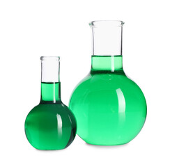 Flasks with green liquid isolated on white