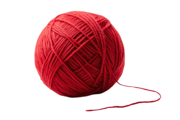 Bright red ball of yarn resting on a flat surface ready for crafting or knitting projects in a cozy indoor setting