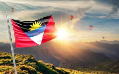 Antigua and Barbuda flag waving in beautiful scenery. Antigua and Barbuda national flag for...