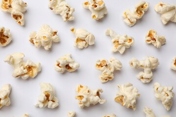 Tasty popcorn on white background, flat lay