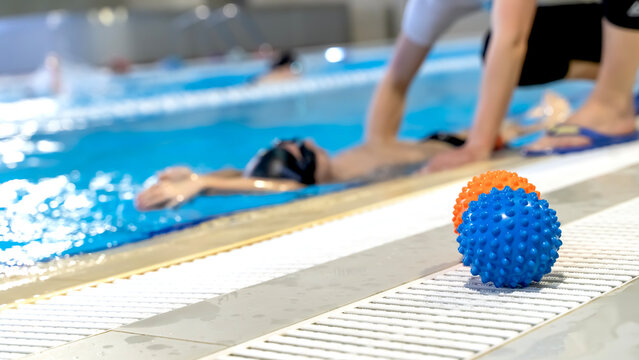 Boy in the pool to learn to swim or swimming