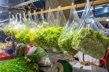 Cowslip creeper, Sesbania, and Agasta flowers in clear plastic bags, hanging fresh and ready for...