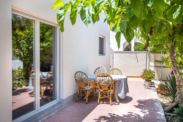 Outdoor Dining Area Under Tree Shade