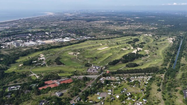 Drone view of Kennemer Golf and Country Club near Zandvoort with green courses and dunes