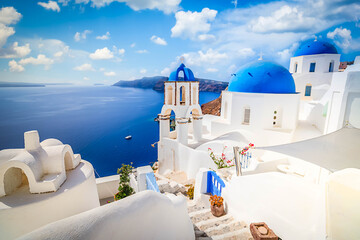 traditional greek village Oia of Santorini, with blue domes against sea and caldera, Greece