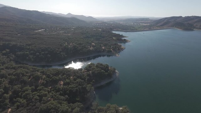 RAW Drone Footage of Lake Cachuma &mdash; Santa Barbara California Reservoir with Rolling Hills in Sunny Daylight