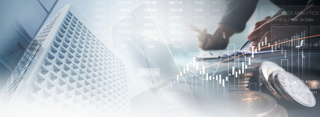 Business, finance and investment concept. Finance analyst using digital tablet analyzing and...