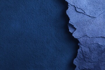 Deep blue textured surface with layered, torn edges