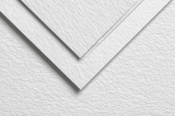 Close-up of overlapping white textured sheets of paper