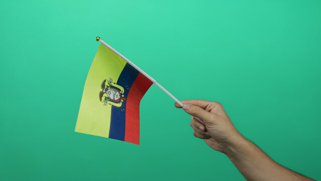 Man holding ecuador flag against green background, showcasing pride and identity. - Powered by Adobe