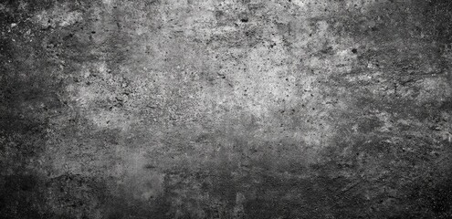 A grayscale image of a textured concrete surface.  The surface shows various shades of gray, with a rough, uneven texture.  Patches of darker and lighter gray are visible