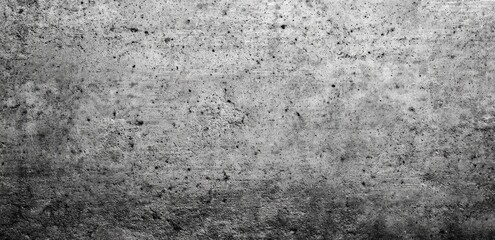Gray concrete wall texture with subtle variations in tone and speckled surface
