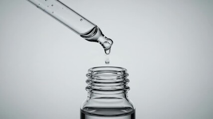 Liquid dropping from pipette into glass bottle science healthcare and beauty concept
