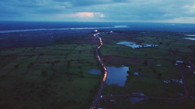 Aerial view of huge crowd going for pilgrimage to a hindu temple on chambal river in rajasthan india