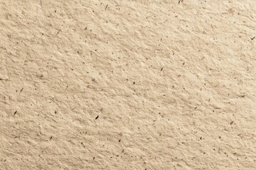 Beige textured paper surface with embedded fibers