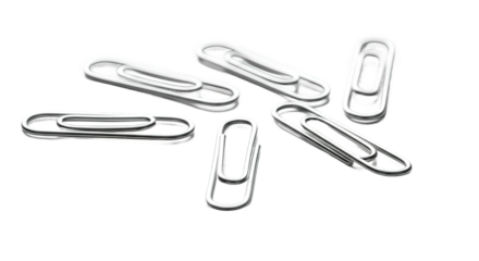 Silver Paperclips Scattered on White Background