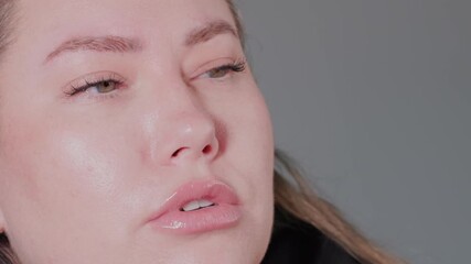 Closeup shots showcasing intricate lip pout expressions against a neutral backdrop enhance aesthetic appeal