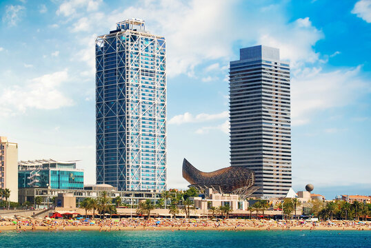 BARCELONA, SPAIN - AUGUST 12: Hotel Arts and Mapfre Tower and Peix sculpture in Port Olimpic on August 12, 2011 in Barcelona, Spain. 