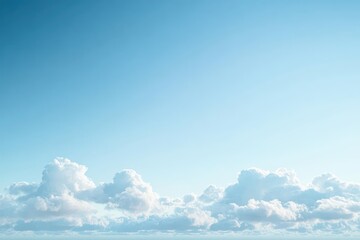 Bright blue sky filled with soft, fluffy white clouds scattered across the horizon during a clear day