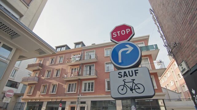 Stop road sign and bike path in France.