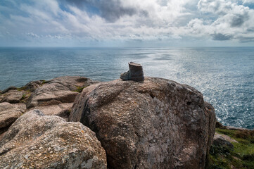 Old boot symbolizing the end of the Camino de Santiago at cape Finisterre