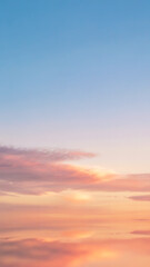Fototapeta premium Pastel sunset sky with soft clouds and gradient colors for mobile wallpaper background